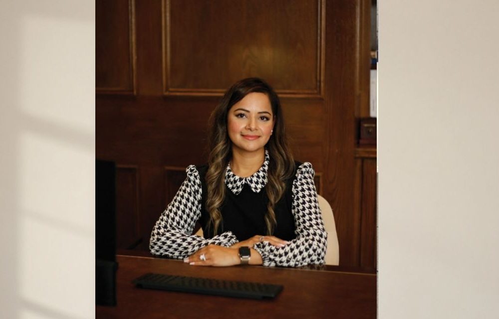 Shivani Sharma Sitting at desk