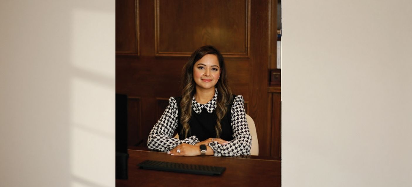 Shivani Sharma Sitting at desk